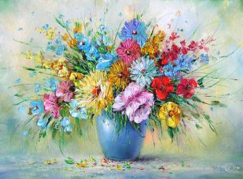Colourful bouquet in a blue vase