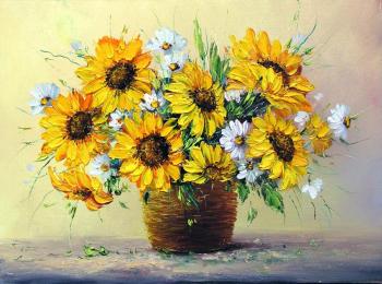 Sunflowers and camomiles in basket