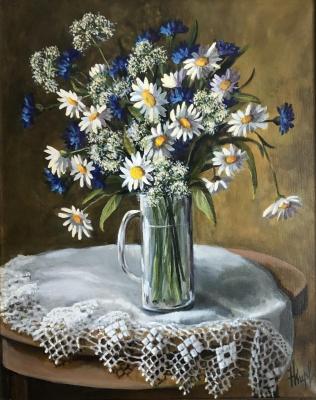 Daisies and cornflowers in a glass mug. Kirilina Nadezhda