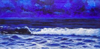 The waves are splashing in the blue sea. Lagno Daria