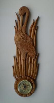 Carved clock made of wood "Heron" (Carved Wood). Petin Mihail