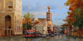 Sunset ray glides across the rooftops. Petrovka Street (Red Trolleybus). Shalaev Alexey