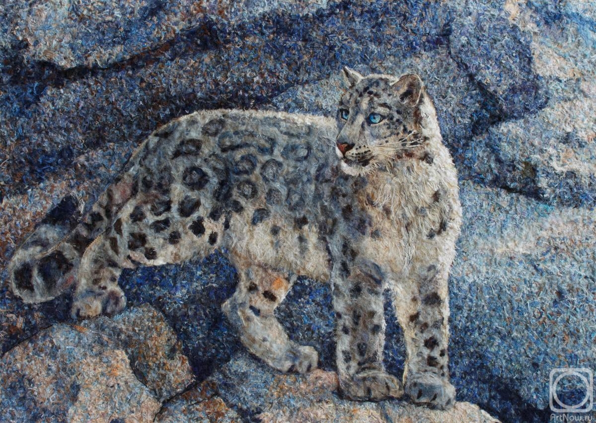 Hitkova Lyubov. snow leopard among the rocks