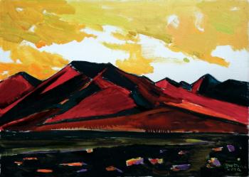 The red mountains. Golden clouds