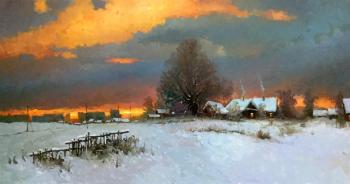Sunset in the village in winter