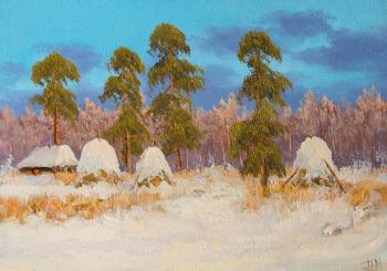 Haystacks powdered with snow