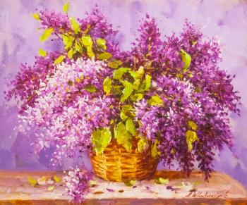 A magnificent bouquet of lilacs in a basket