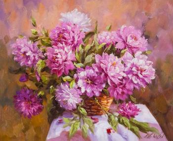 Bouquet of peonies in a basket