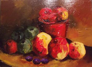 Apples in a red vase