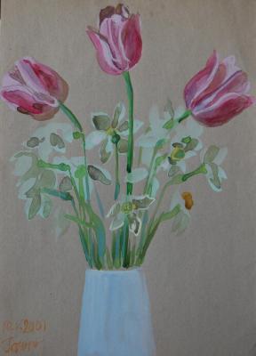 Daffodils and tulips in a white vase