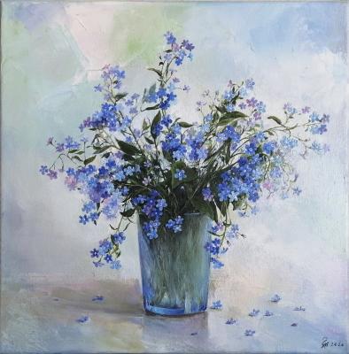 Forget-me-nots in a blue glass