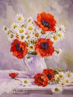 Poppies and chamomiles in a white jug