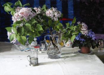 Lilac on the table. Dolgaya Olga