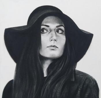 Portrait in a black hat. Isaev Gennadiy