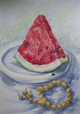 A slice of watermelon and an amber rosary (Juicy Watermelon). Gorenkova Anna