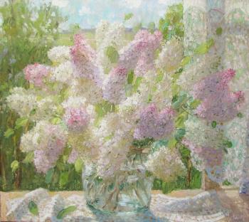 A bouquet of lilacs by the window