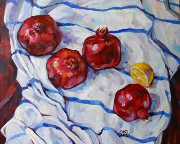 Pomegranates and lemon on white. Zhukovskaya Yuliya