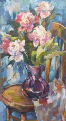 Bouquet of peonies on a chair
