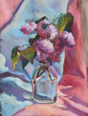 Lilac branch in a glass jar