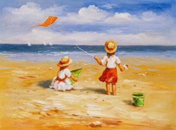 Children on the beach. Behind a kite