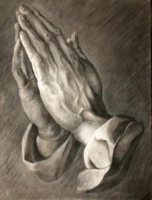 Replica of the painting by A. Durer. Hands of a Praying Man