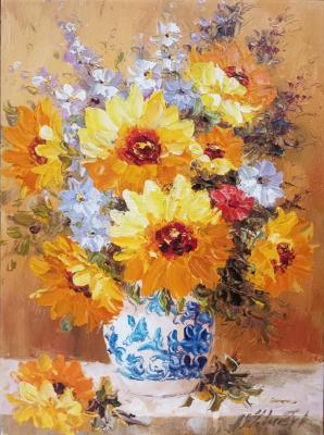 Sunflowers in a white and blue vase
