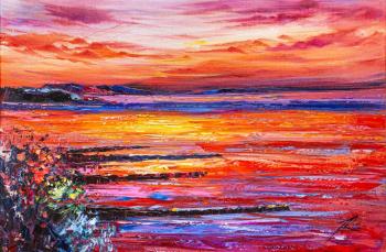 Fiery sunset on the coast. Rodries Jose