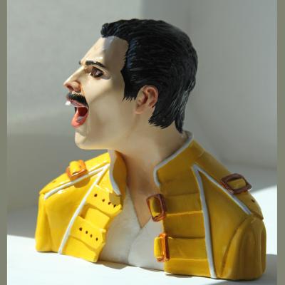 Freddie Mercury figure in an yellow jaket (Rockportrait). Churkina Larisa