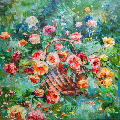 Basket with roses in the garden. Rodries Jose