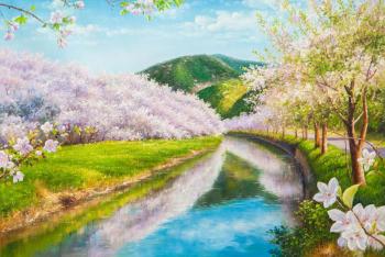 Cherry blossoms against the backdrop of mountains. Romm Alexandr