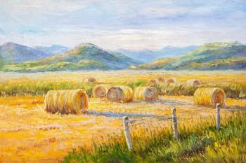 Haystacks against the backdrop of mountains (Haystacks Landscape). Vlodarchik Andjei