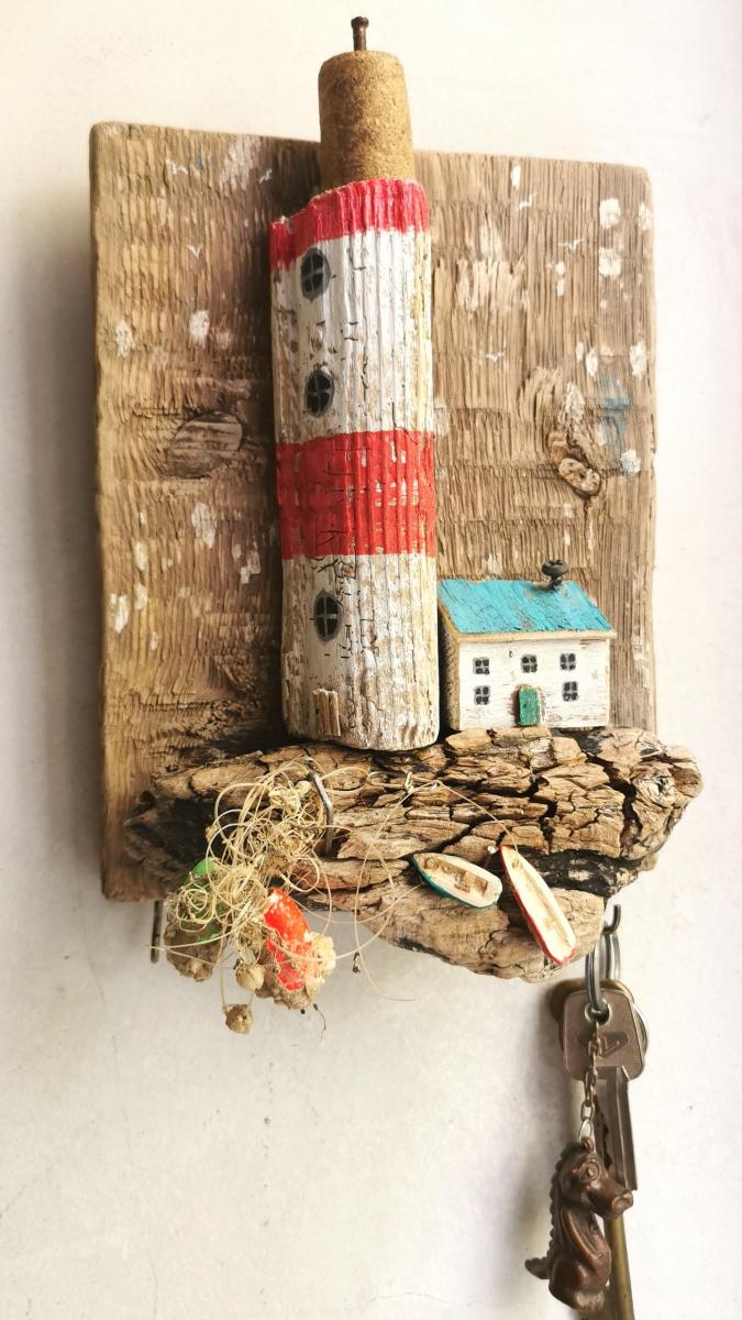 Gorenkova Anna. The key keeper with a lighthouse, a house and boats