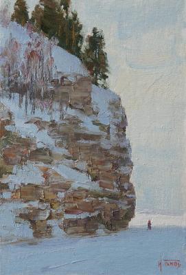 Under the winter cliff