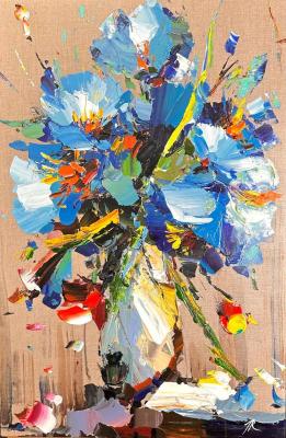 Blue flowers in a white vase. Rodries Jose