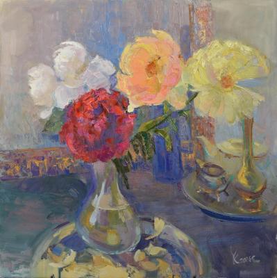 Bright peonies on a dark background in a decanter