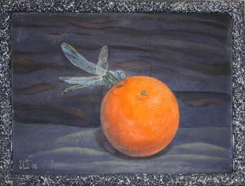 Dragonfly on an orange. Green Irina