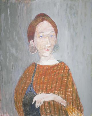 Girl in a chanterelle blouse with a bag and blue eyes
