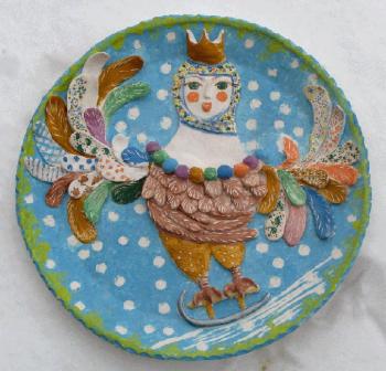Plate on a wall a bird Sirin