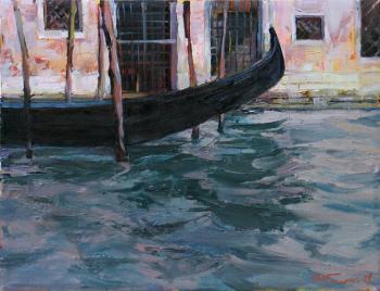Venice. An old gondola (The Channel Water). Grishchenko Igor