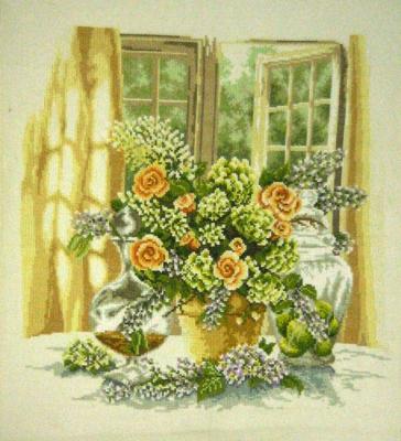 Bouquet of flowers on the table by the window. Gvozdetskaya Tatiana