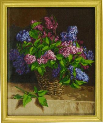 Bouquet of lilacs in a basket