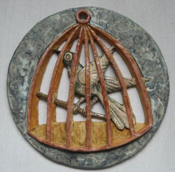 A bird in a cage (Clay Plate). Pomelova Innesa