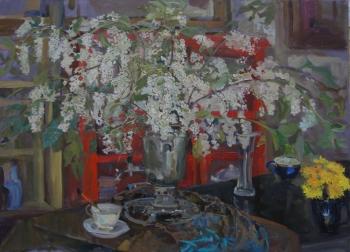 Cherry in a samovar on the background of a red cabinet