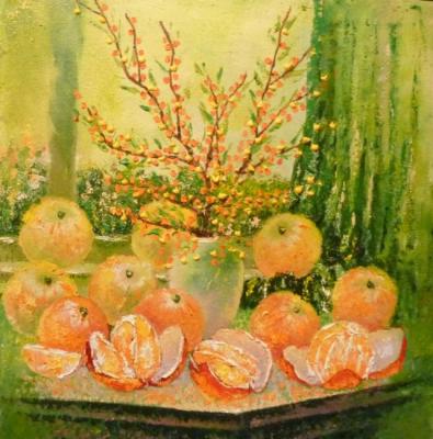 Oranges and sea buckthorn on a green background. Naddachin Sergey