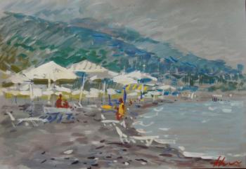 On the beach, white umbrellas